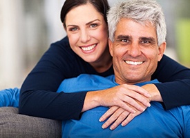 Man with All-On-4 on couch with his spouse