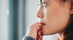 Closeup of woman biting her nails
