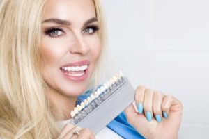 woman holding veneers