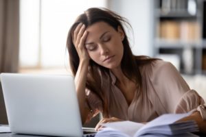 tired woman suffering from chronic stress 