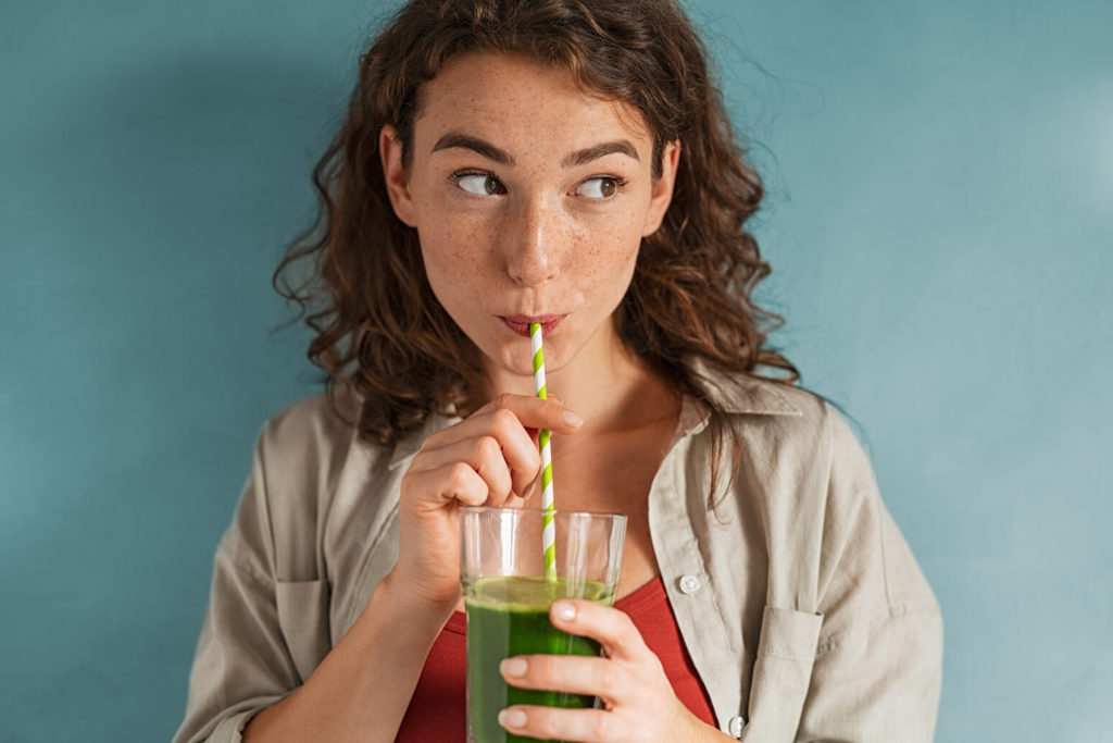 person drinking fresh juice