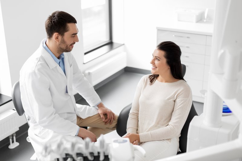 patient learning about benefits of porcelain veneers