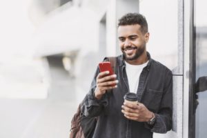 man looking at his smartphone