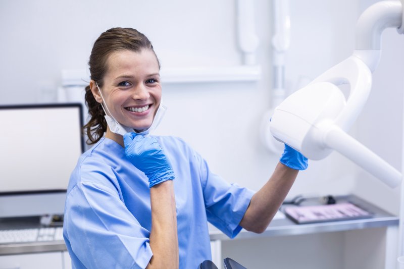 dental hygienist holding a headlamp