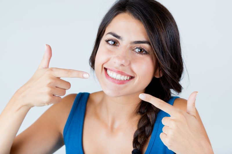 A woman smiling with white teeth