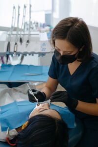 Dentist looking in woman’s mouth